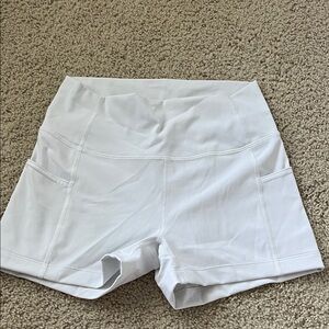 Aritzia TNA white biker shorts with pockets